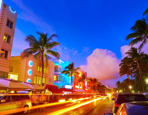 a busy city street and smeared traffic lights