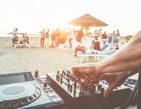 A dj at a beach festival