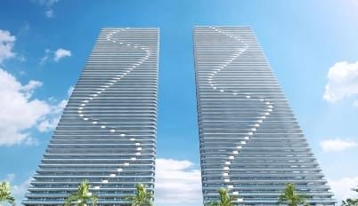 Two matching highrises with wave pattern on side