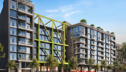 Condo building with green artistic structure on front