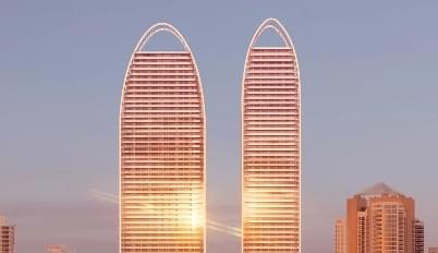 Two matching highrises of metal and glass