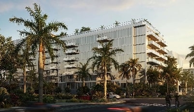 Mid-rise condo surrounded by junglelike palms