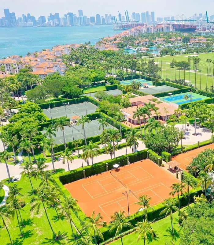 Aerial view of condo buildings next to the water