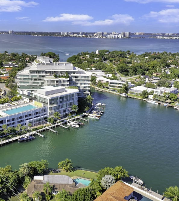 Aerial view of homes next to the water